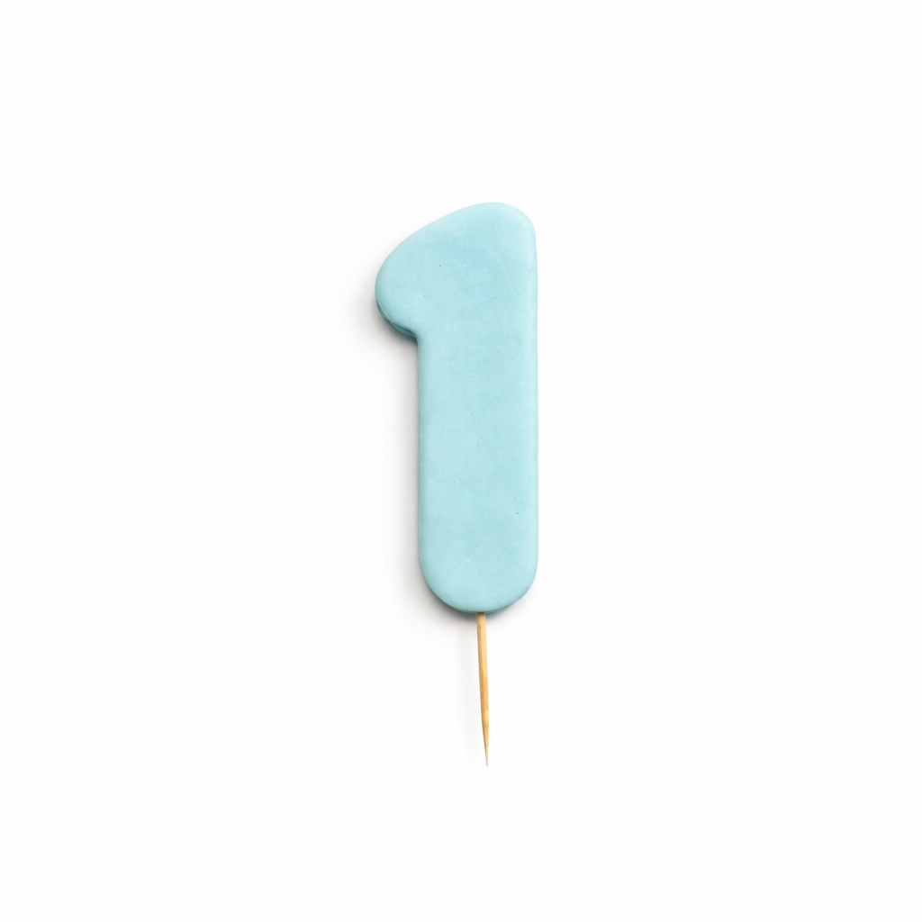 Blue number 1 cake topper on a white background