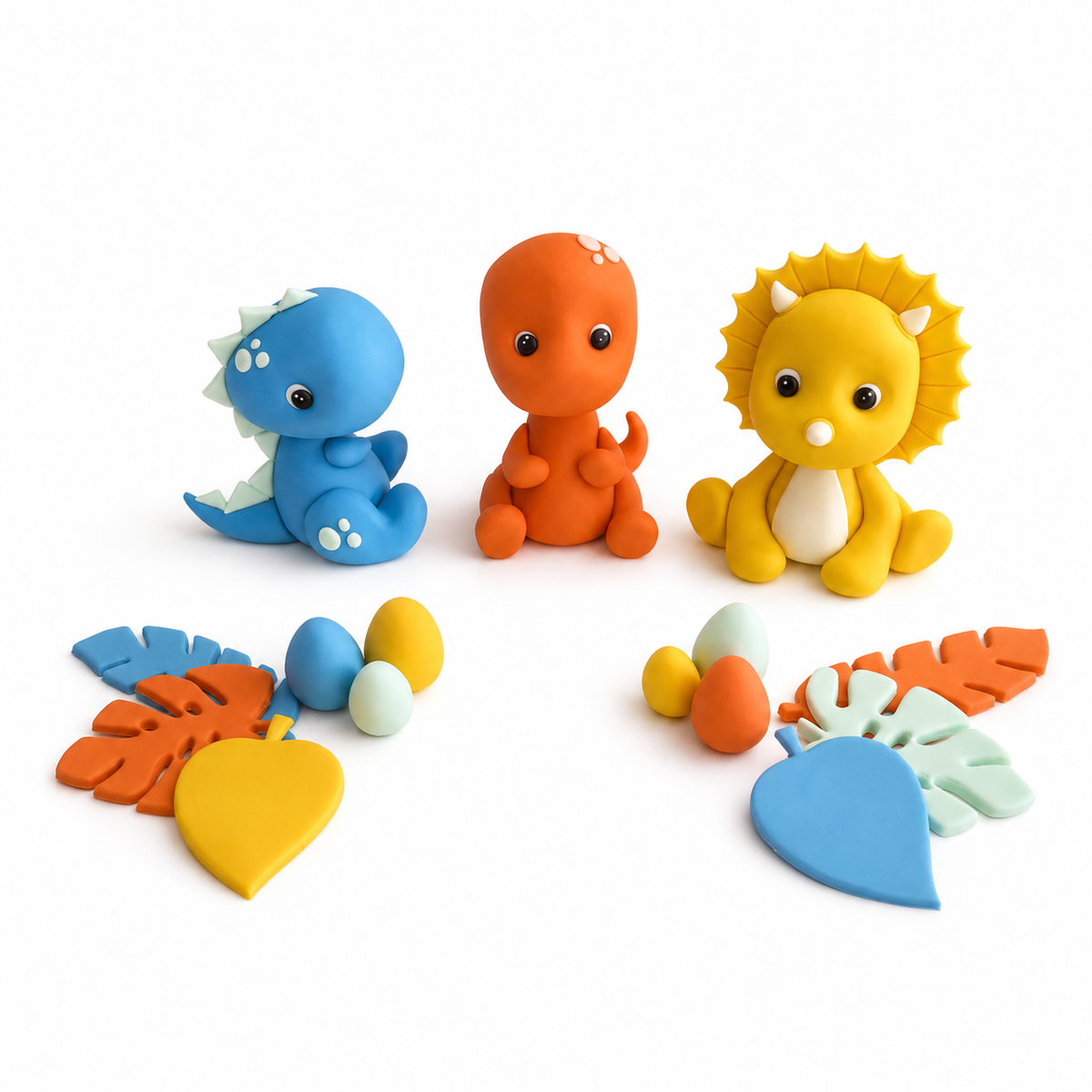Custom fondant dinosaur cake topper set with three colourful dinosaurs, tropical leaves and dinosaur eggs
