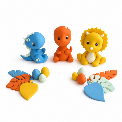 Custom fondant dinosaur cake topper set with three colourful dinosaurs, tropical leaves and dinosaur eggs